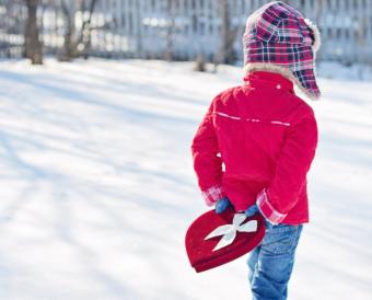 Valentine child carrying gift