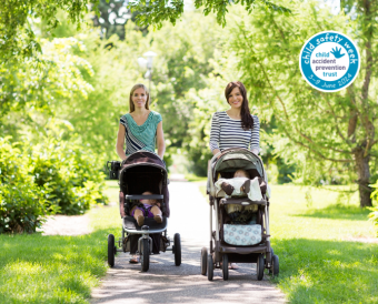 two mums walking with babies in prams